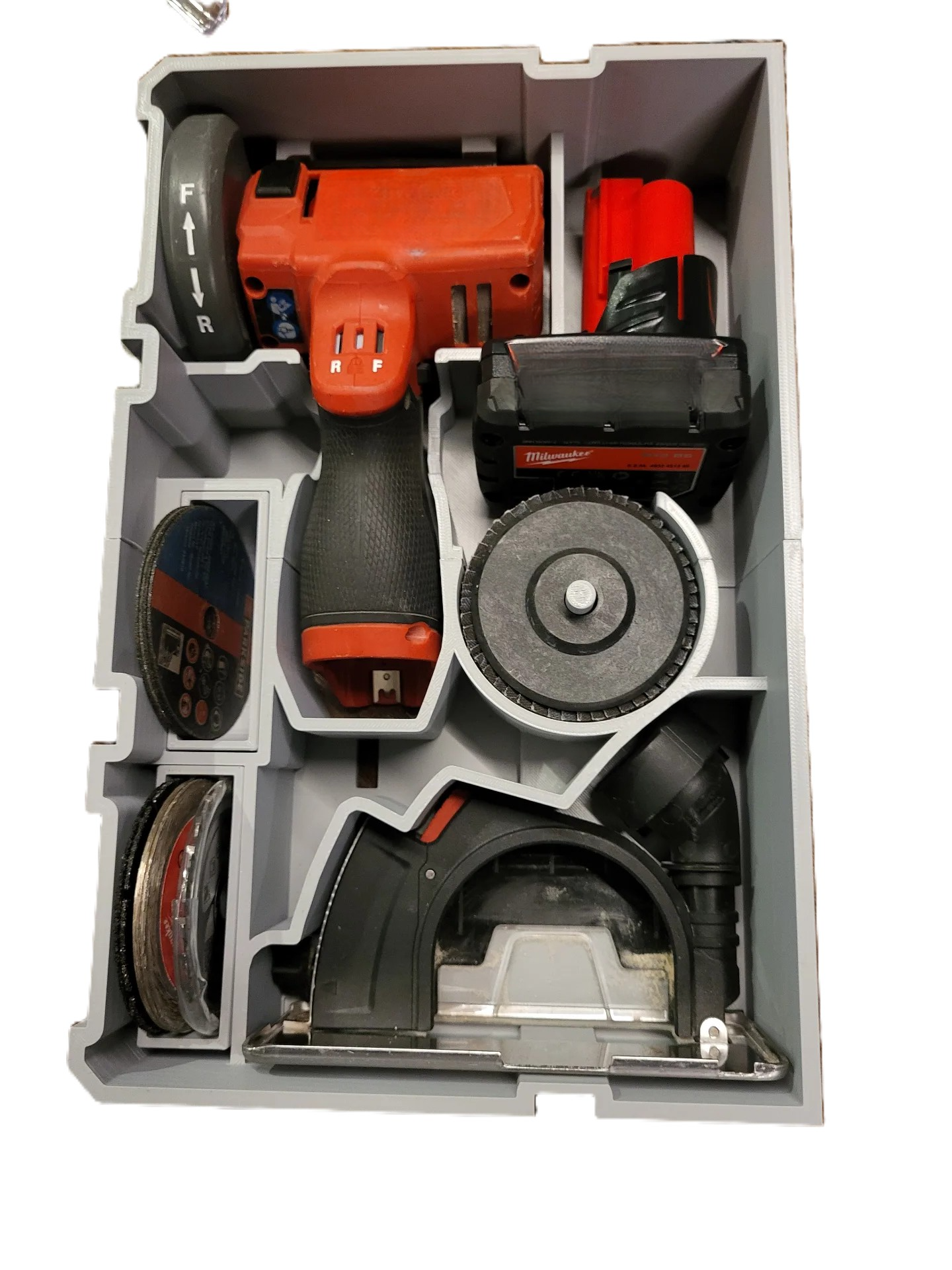 Milwaukee M12 Cutoff Tool Insert for 2522-20 & AUS/UK Models – Insert Only, showcasing the efficient arrangement of Milwaukee tools, emphasizing durability and minimized movement during transport.