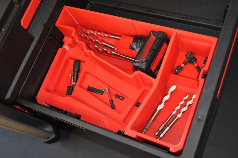 Interior view of the Milwaukee M12 Fuel Impact Driver Gen 3 Packout Insert, showcasing a well-organized arrangement of drill bits and tools.