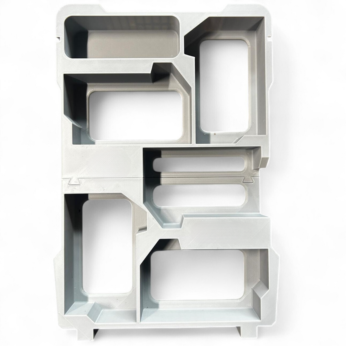 Detailed image of the Milwaukee Packout insert layout, specifically designed to fit 5x M18B5 batteries securely.