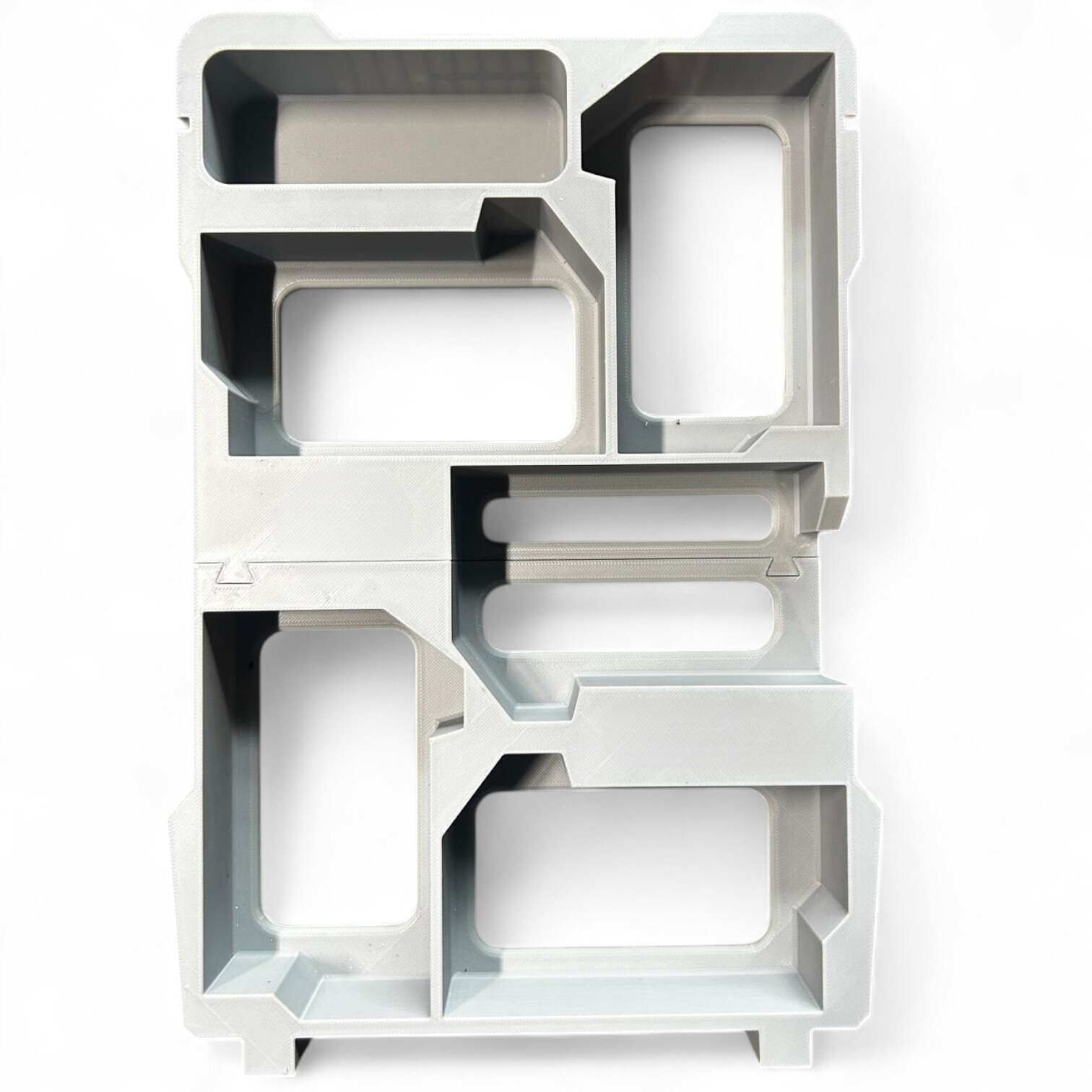 Detailed image of the Milwaukee Packout insert layout, specifically designed to fit 5x M18B5 batteries securely.