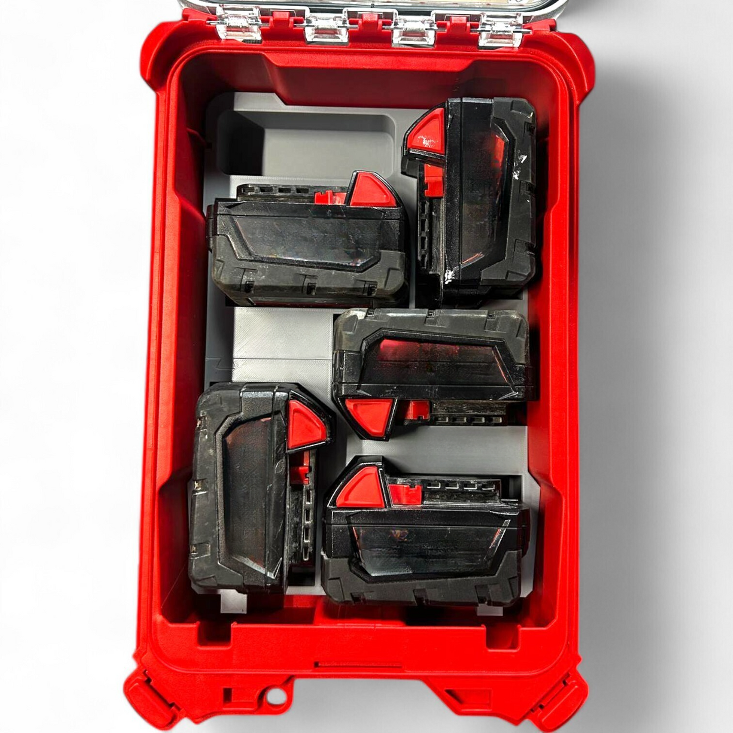 Close-up view of Milwaukee Packout insert showing secure storage for 5x M18B5 batteries. Compatible with Packout 48228435.