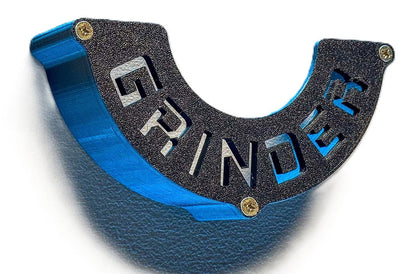 Close-up view of a black Angle Grinder Wall Mount featuring the word 'GRINDER', emphasizing its sturdy construction and tool organization.