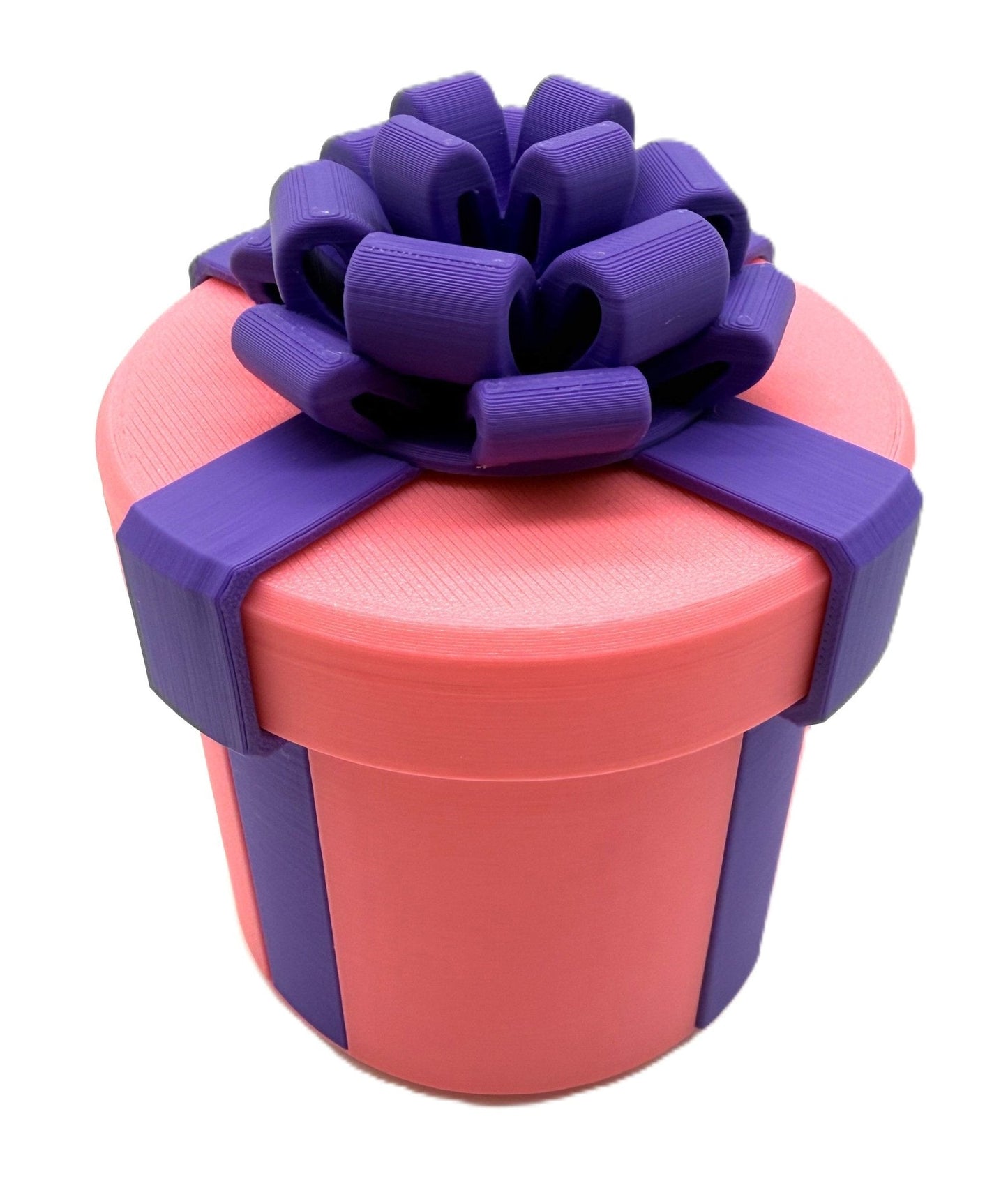 Pink gift box adorned with a purple bow, an element from the Annoying Gift Box Prank Set - Hilarious Gag Gift Box Puzzle Challenge for Cash.