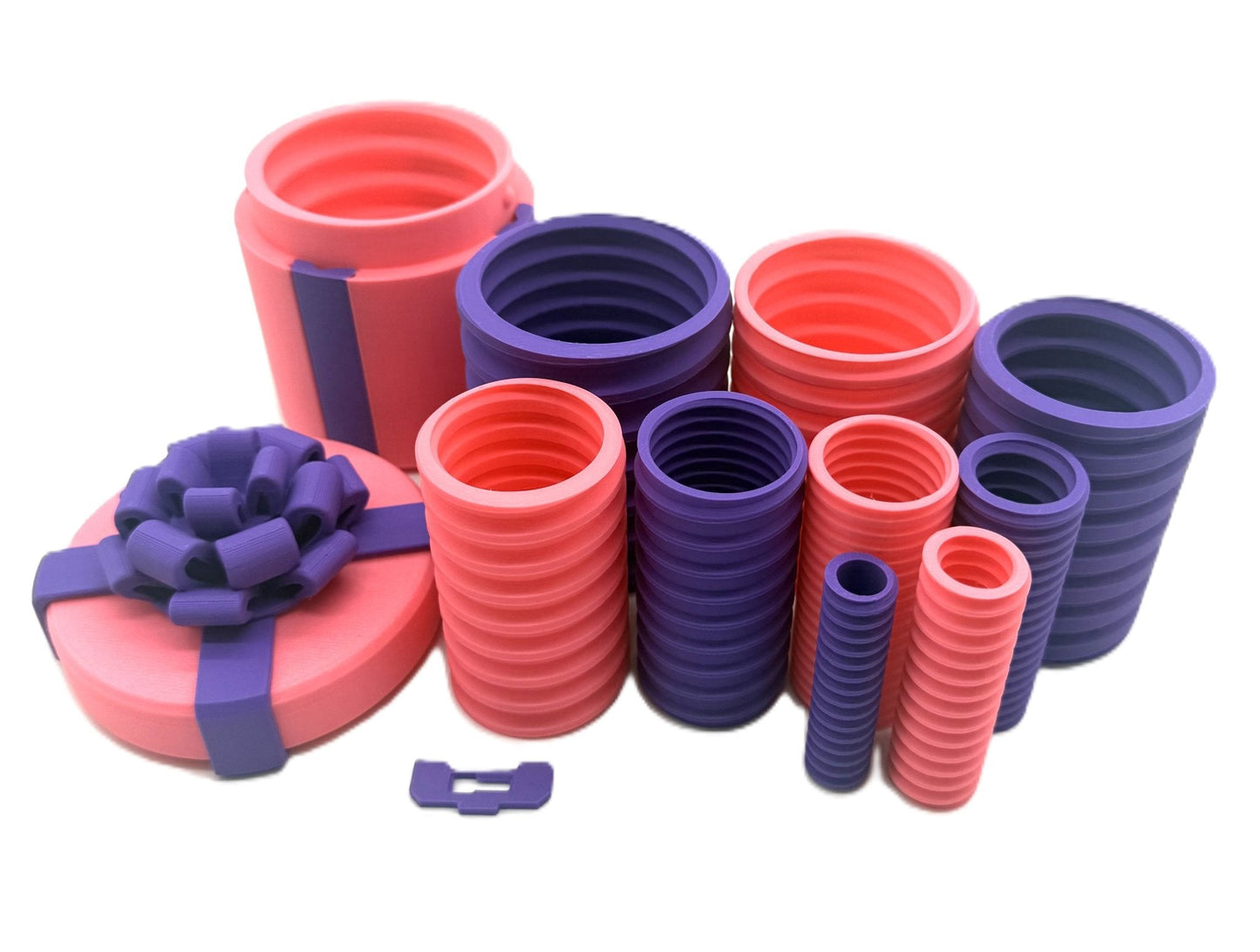 Annoying Gift Box Prank Set featuring nested gift boxes in pink and purple, designed for a hilarious gag gift experience.