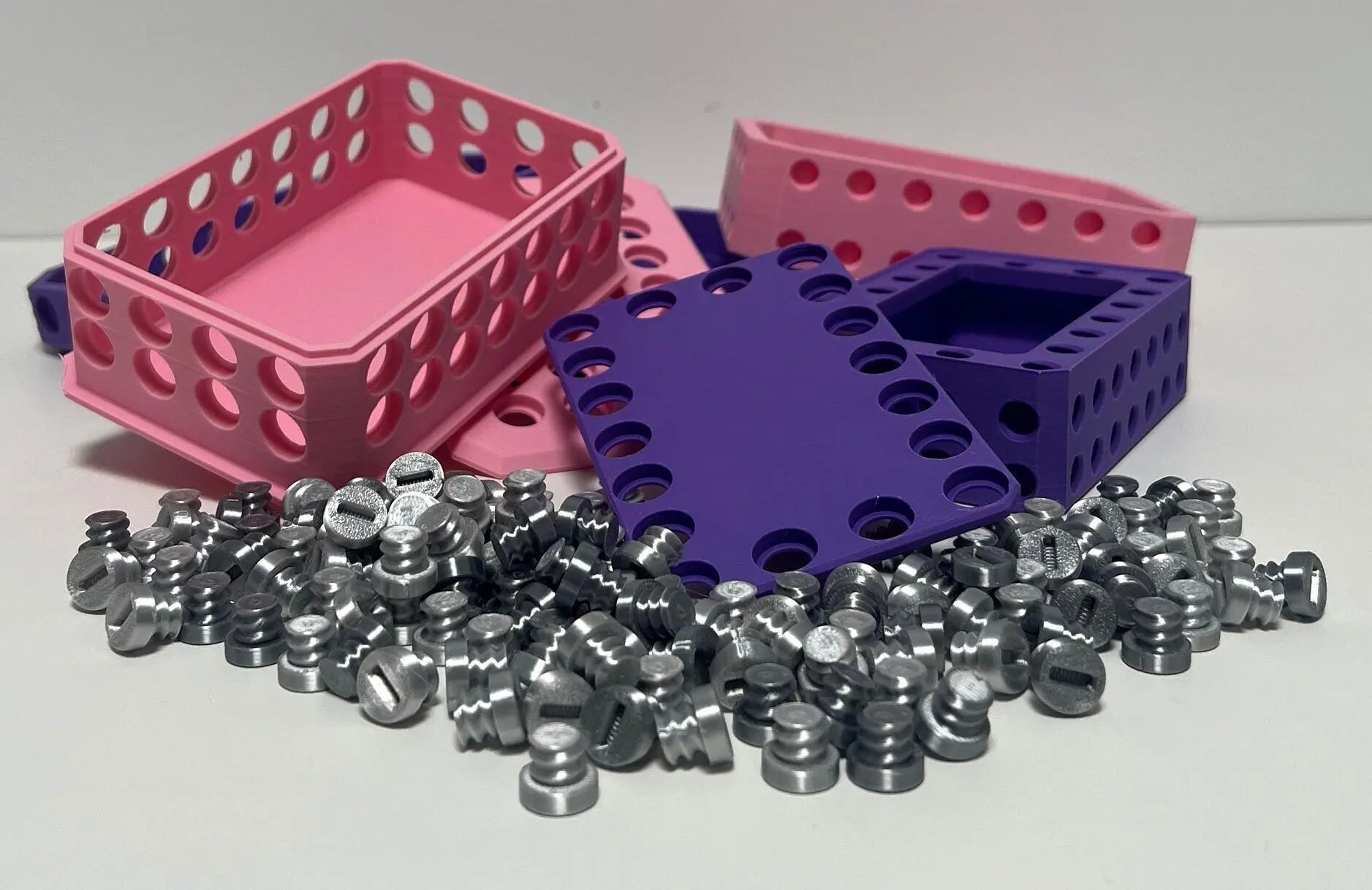 Challenging Card Holder Gift Box in Purple, Pink, and Silver featuring a vibrant arrangement of boxes and metallic pieces in a stylish display.