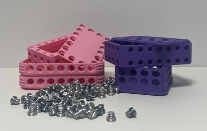 Challenging Card Holder Gift Box in Purple, Pink, and Silver with vibrant colored boxes stacked next to a pile of silver accessories.