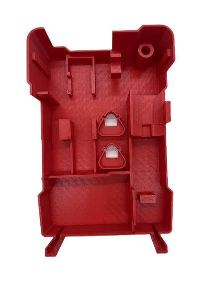 a red plastic object with a hole in the middle