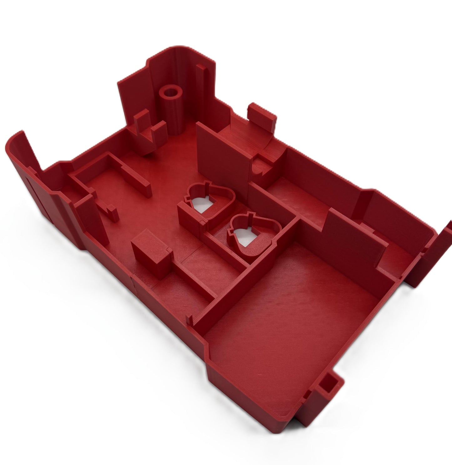 a red plastic object on a white background