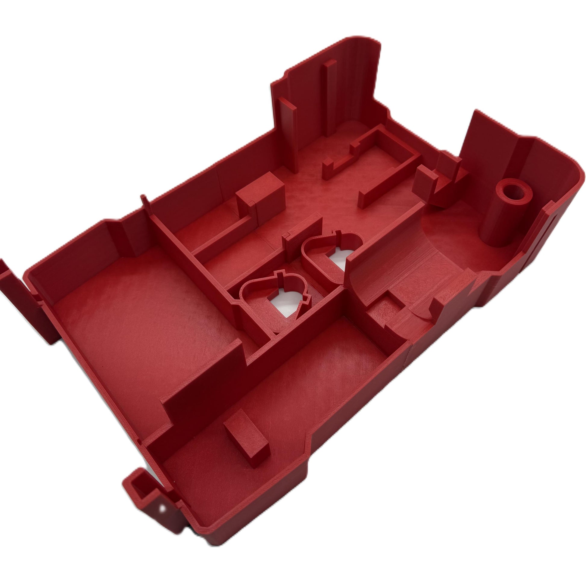 a red plastic object with a hole in the middle