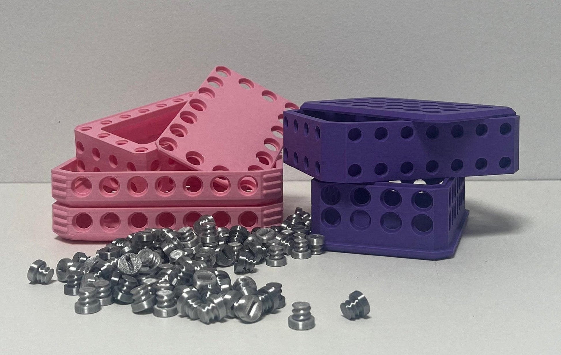 134-screw puzzle box featuring pink and purple interlocking blocks with scattered silver screws, customizable gift box.