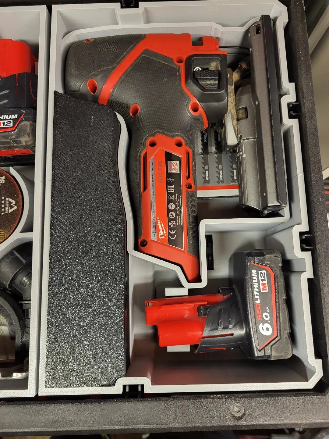 Organized tools within the Packout Insert for M12 Fuel Jigsaw – USA 2445-20 / AUS/UK M12JS including battery and jigsaw, demonstrating efficient storage and easy access.