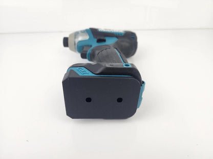 Close-up view of Makita M12 Deep Tool Holder showcasing a drill with a battery attachment, highlighting the secure fit for organized tool storage.