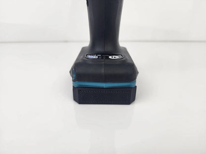 Front view of a battery compatible with the Makita M12 Deep Tool Holder - Wall-Mountable Battery Tool Organizer, showcasing the secure fit for efficient storage.