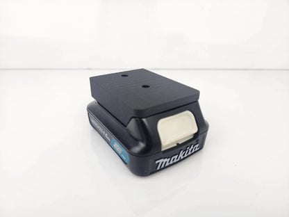 Makita M12 Wall-Mountable Battery Holder showcasing its robust construction and precision-fit design, ideal for organizing Makita batteries.