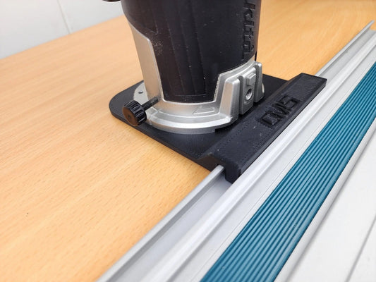 Makita Router Rail Guide showcasing precision tool placement on wood surface, essential for smooth and accurate routing in woodworking.