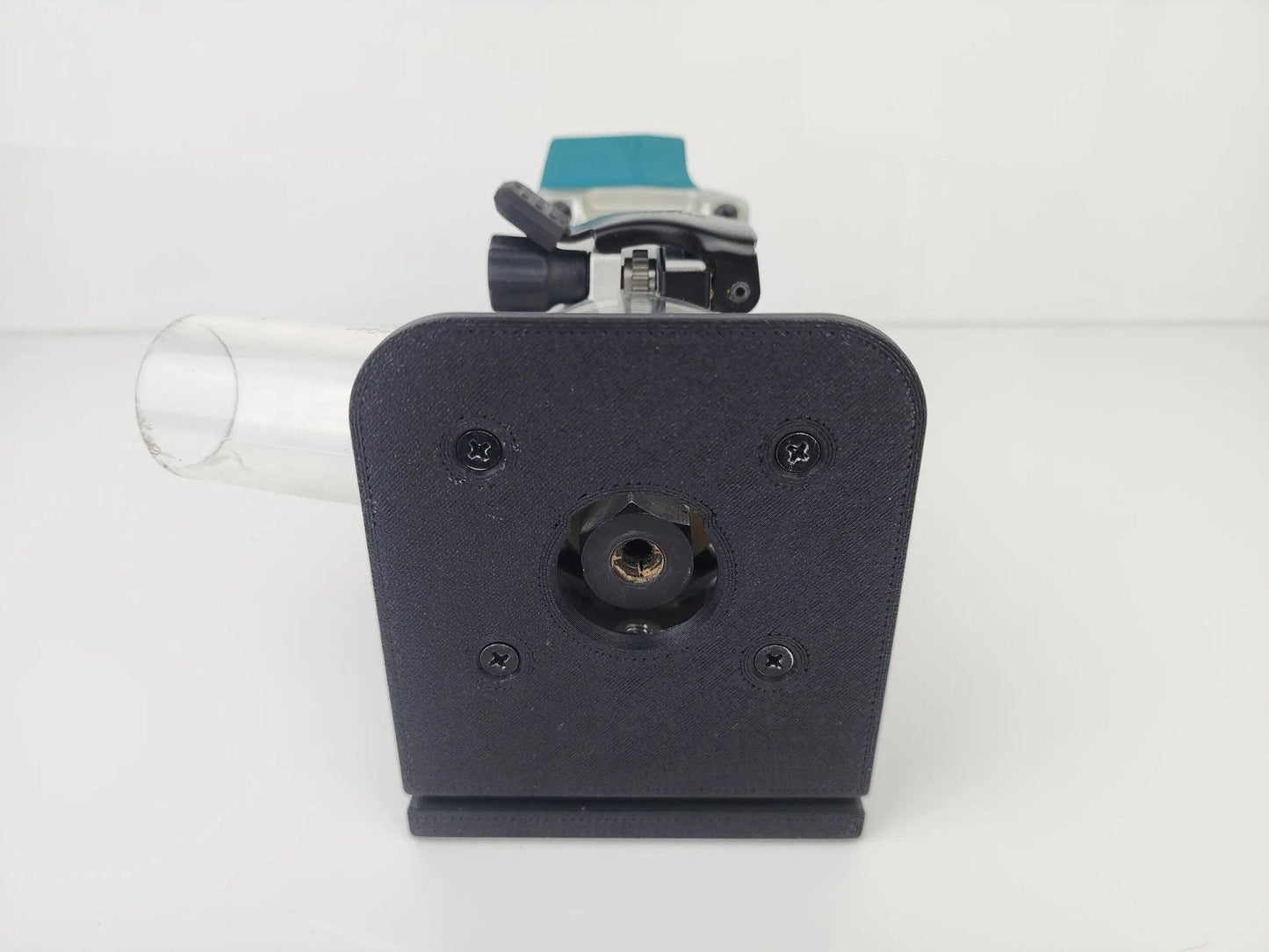 Close-up of Makita Router Rail Guide's base with router attachment, designed for effortless edge cutting in carpentry projects.