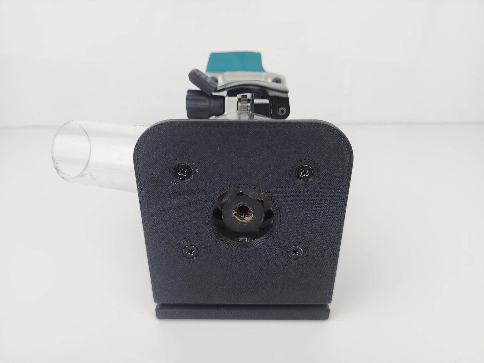 Close-up of Makita Router Rail Guide's base with router attachment, designed for effortless edge cutting in carpentry projects.