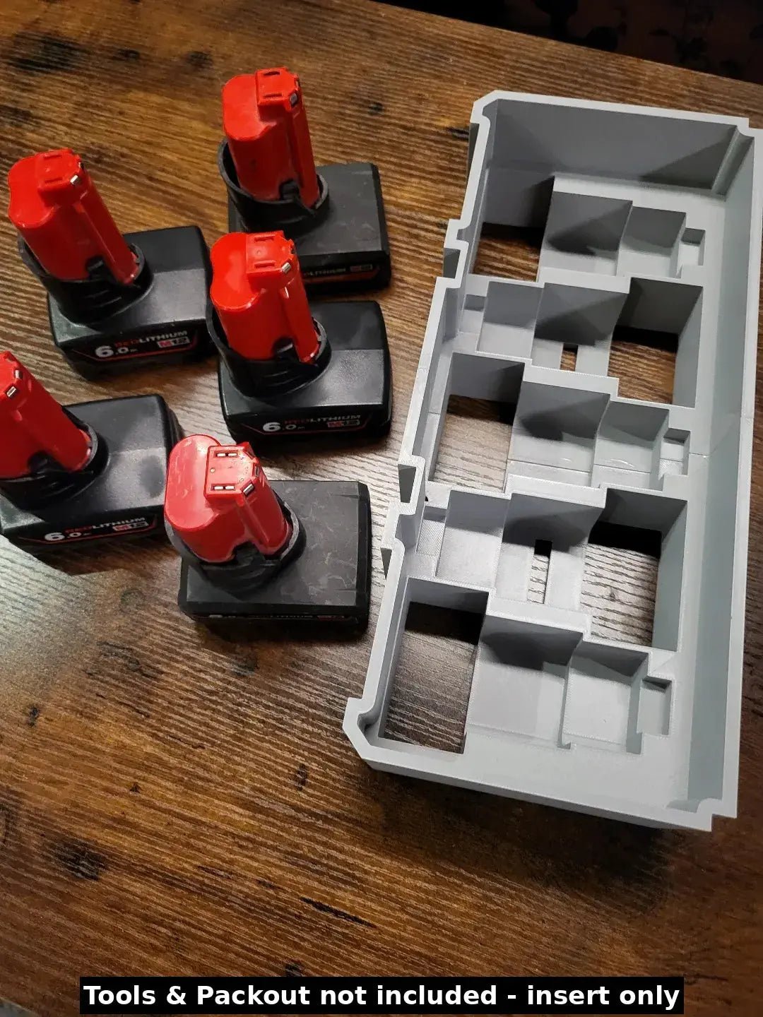 Milwaukee Packout Insert for M12 4.0Ah and 6.0Ah Batteries - Insert displayed alongside Milwaukee batteries, showcasing the efficient storage solution for professionals.