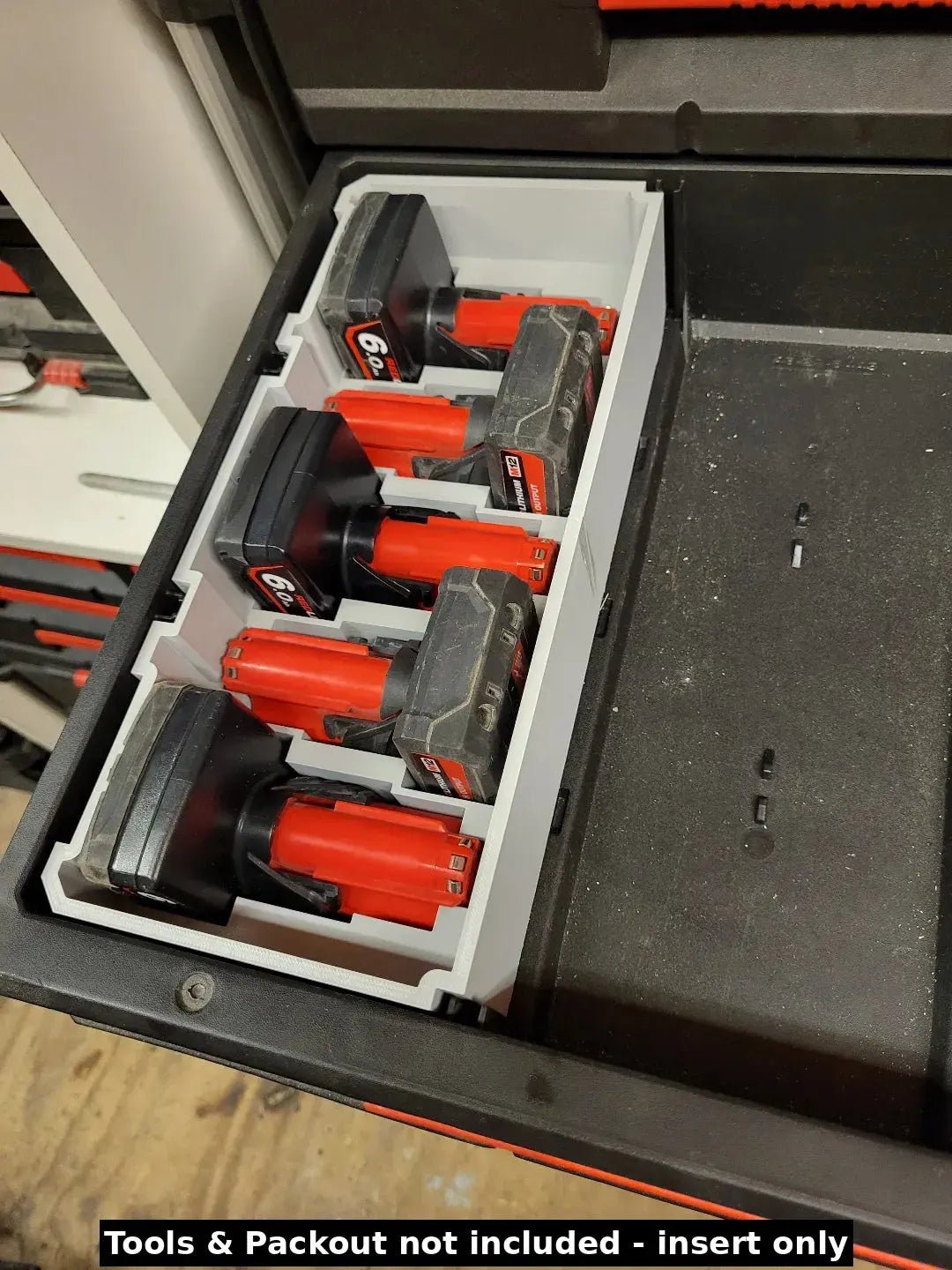 Milwaukee Packout Insert for M12 4.0Ah & 6.0Ah Batteries - A photo illustrating the battery insert in use within a toolbox, highlighting its effectiveness in organizing Milwaukee batteries.