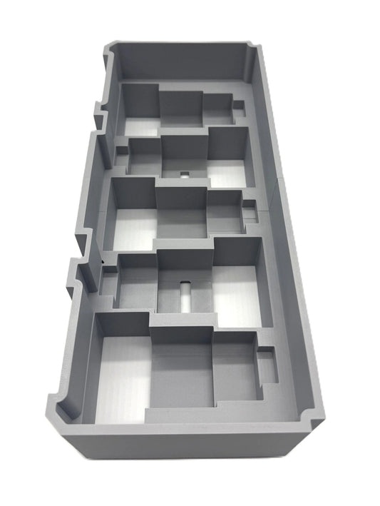 Milwaukee Packout Insert for M12 4.0Ah & 6.0Ah Batteries - Gray plastic storage insert designed to fit Milwaukee Packout boxes, showcasing individual slots for organized tool storage.