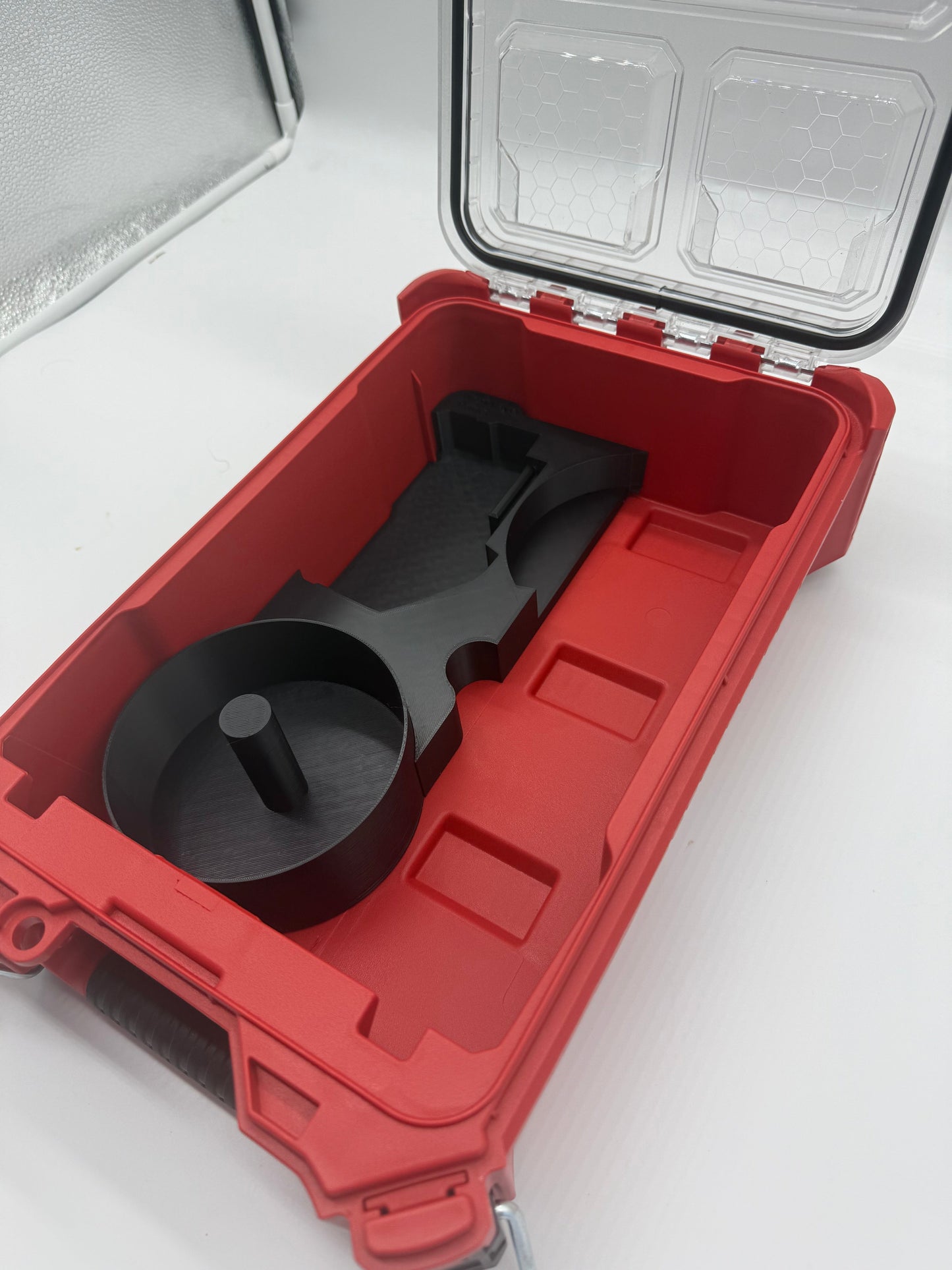 Close-up view of the Packout Insert for M18 4.5" Grinder inside a Milwaukee Packout case, emphasizing the tailored slots for tool organization.