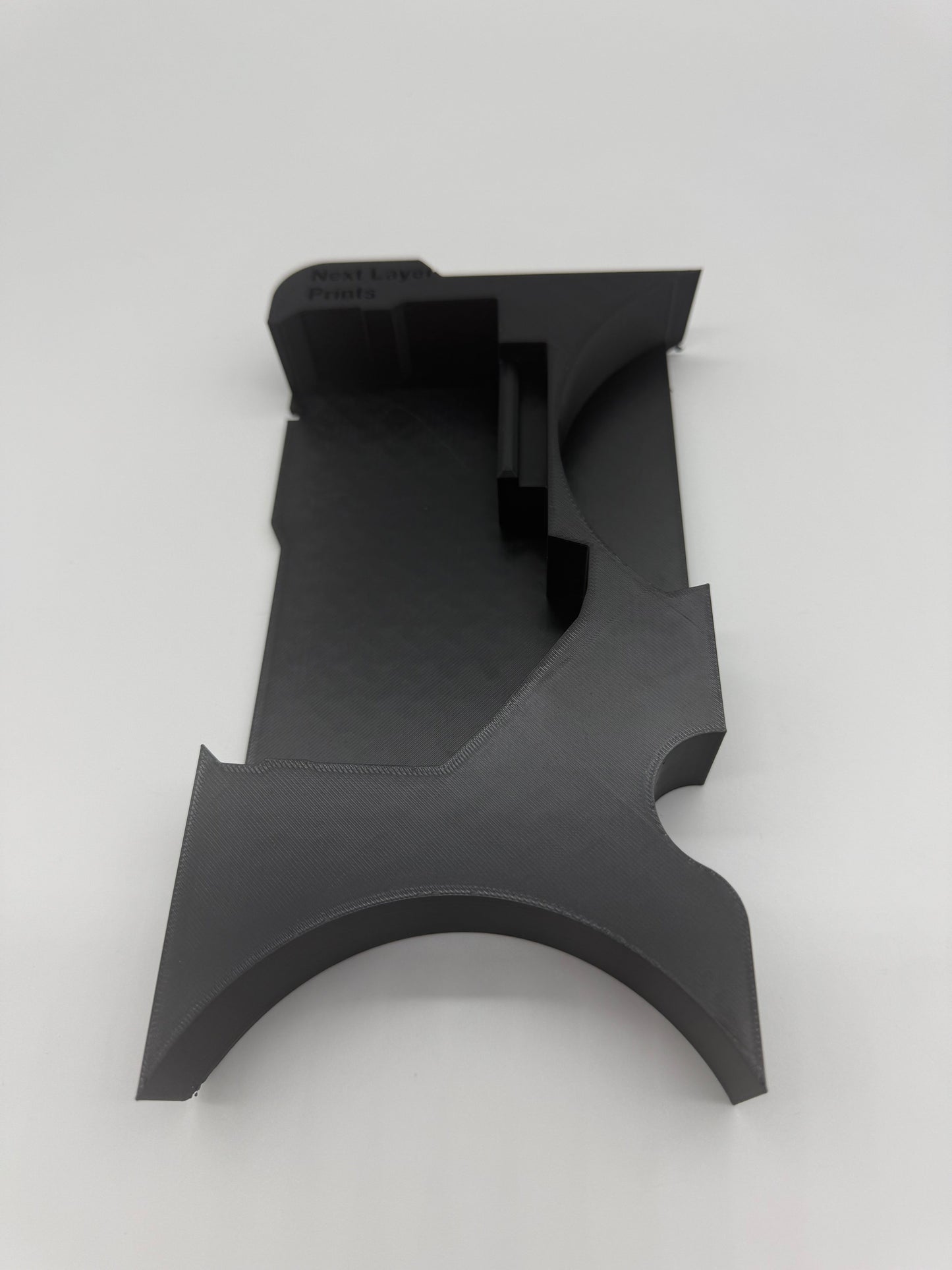 Another angle of the Packout Insert for M18 4.5" Grinder, illustrating its unique shape and compatibility with the Milwaukee Packout storage system.