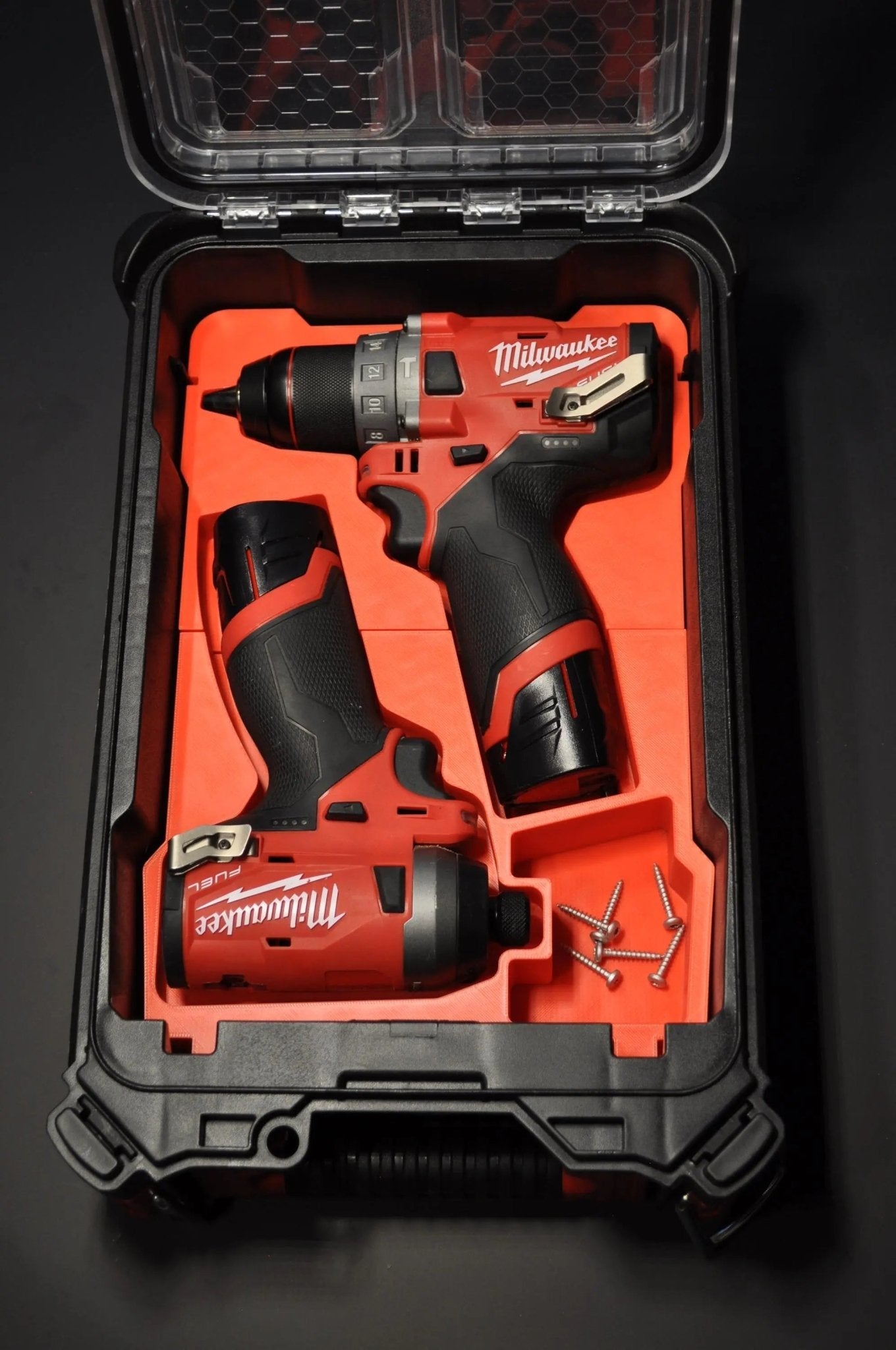 Milwaukee Packout Insert compatible with M12 Fuel Drill and Impact Driver Combo Gen 2 displaying an organized layout of two tools and additional components, emphasizing effective storage and quick access for professional use.