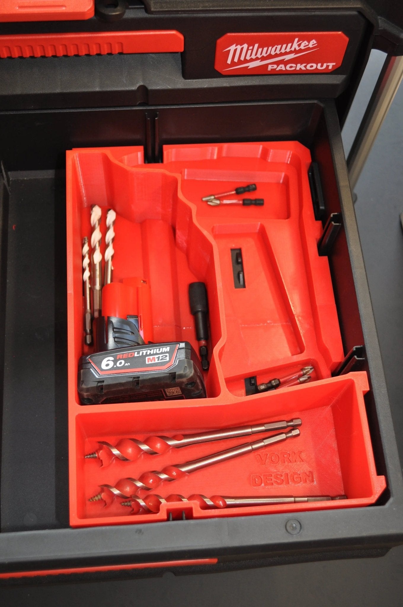Milwaukee M12 Fuel Drill Gen 3 Packout Insert featuring well-structured spaces for a 6.0Ah lithium battery and drill bits, tailored for model 3403-20.