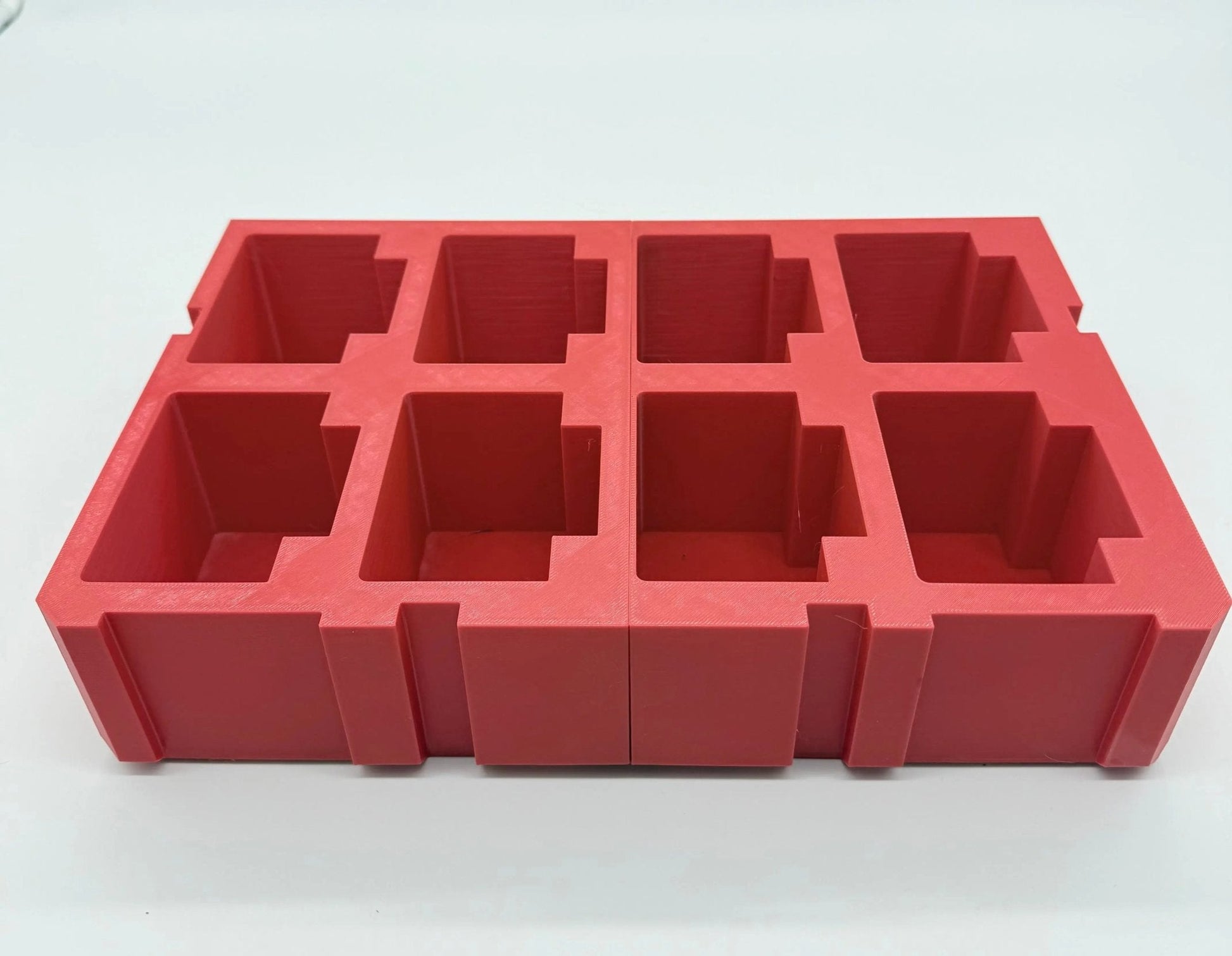 Packout Insert for M18 5.0Ah Battery – Side view of red plastic battery insert, highlighting the sturdy construction and designed slots for secure battery placement.