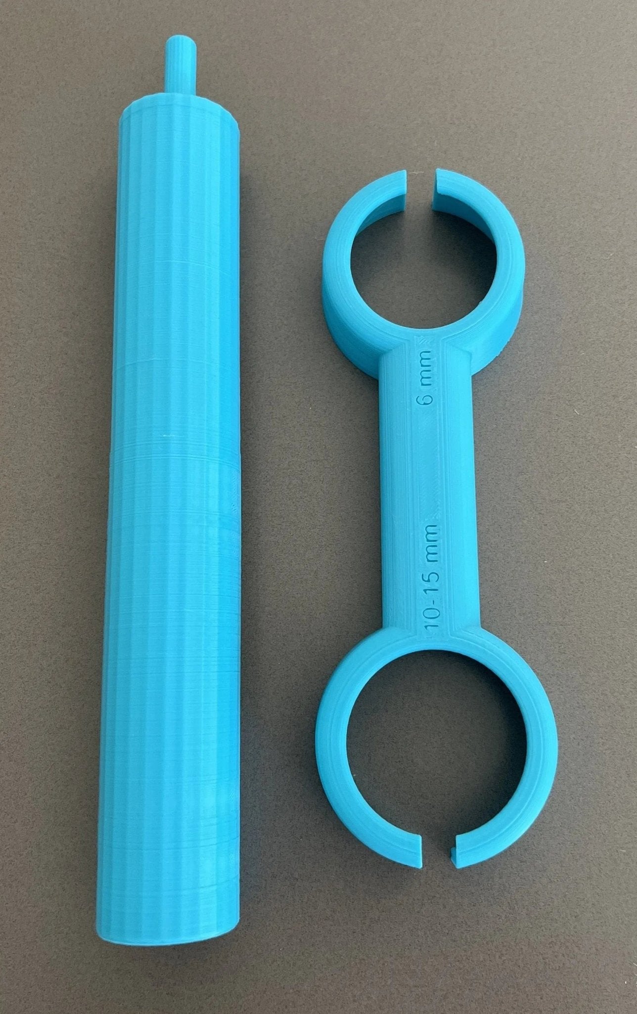 Handyman Depot Reusable Paint Roller Cleaner Tool components displayed, including the blue cleaning tool and a paint roller. Perfect for maintaining painting equipment for sustainable projects.
