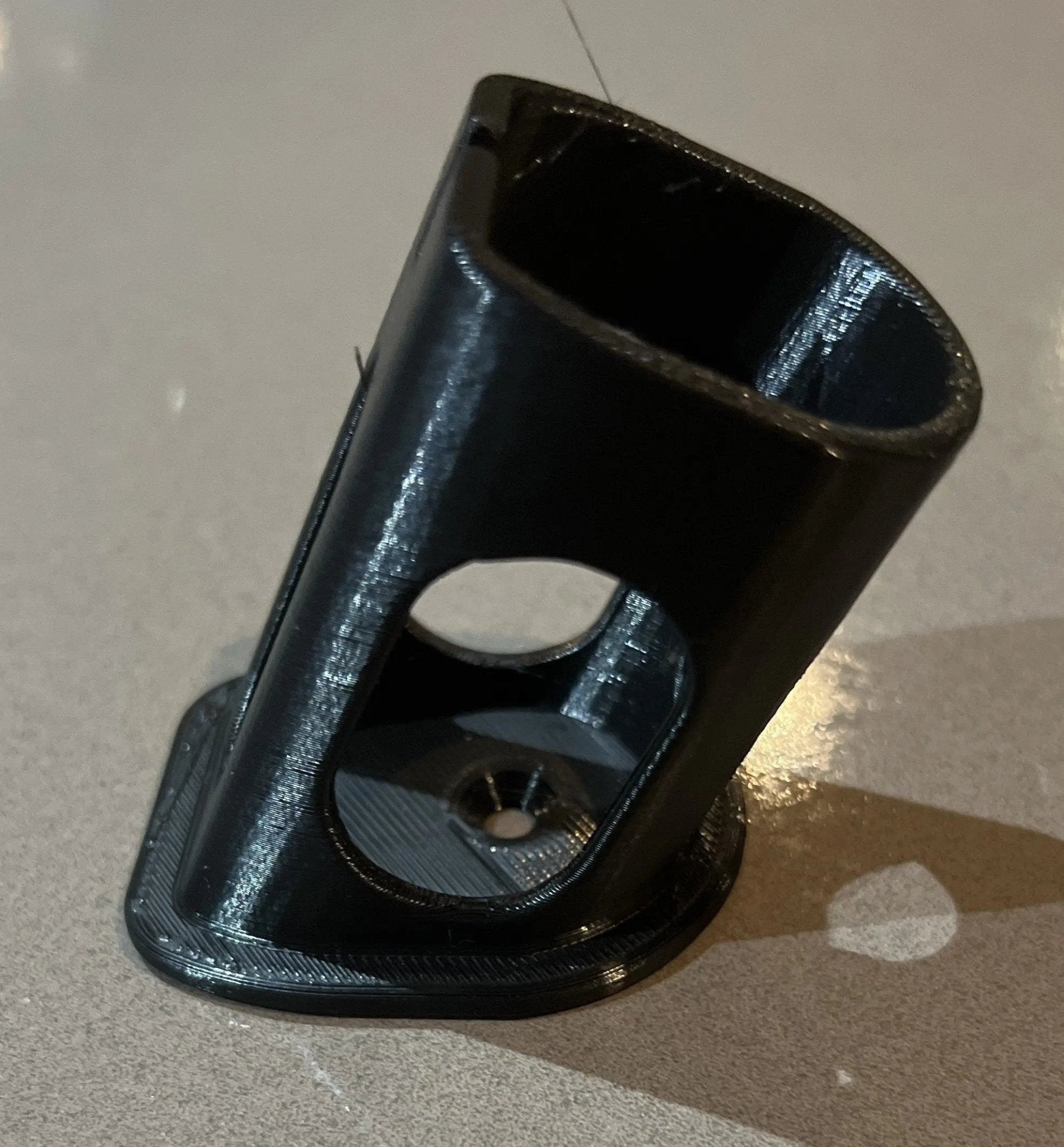 Side perspective of a Ryobi battery holder, demonstrating its design and functionality, a key feature of the Ryobi 18V One+ Battery Holder – Wall-Mountable Organizer for Clean Garage.