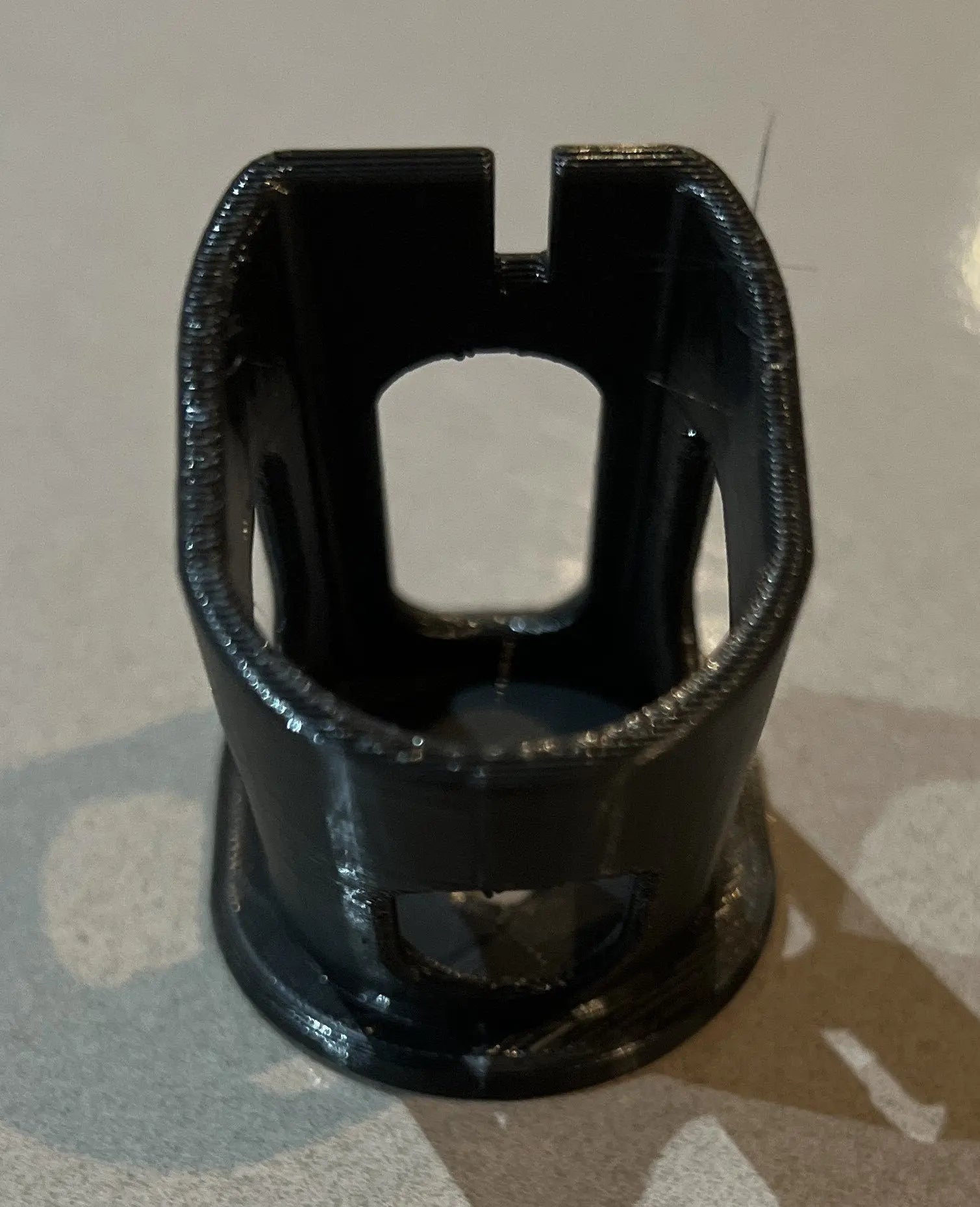 Interior view of a Ryobi battery holder, highlighting the structural details and compatibility features relevant to the Ryobi 18V One+ Battery Holder – Wall-Mountable Organizer for Clean Garage.