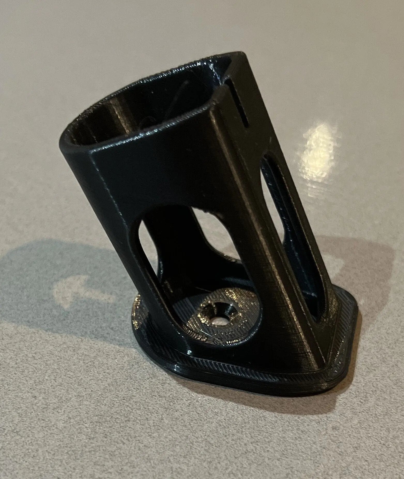 Detailed view of a Ryobi battery holder component, showcasing its precision-fit design for secure storage, emphasizing the Ryobi 18V One+ Battery Holder – Wall-Mountable Organizer for Clean Garage.