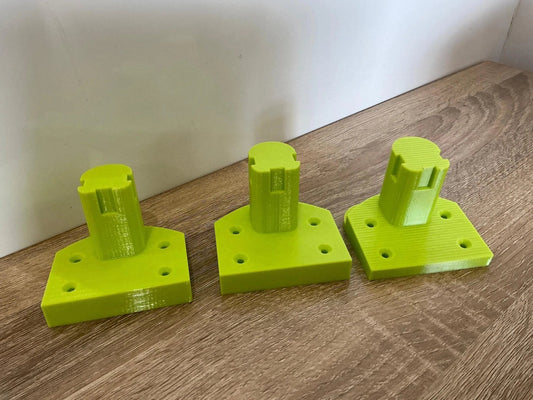 Ryobi Tool Mounts for Efficient Wall or Bench Storage – Organize Garage & Workshop. Three innovative tool mounts designed to securely hold Ryobi tools, featuring a vibrant yellow color with precision design for durability.