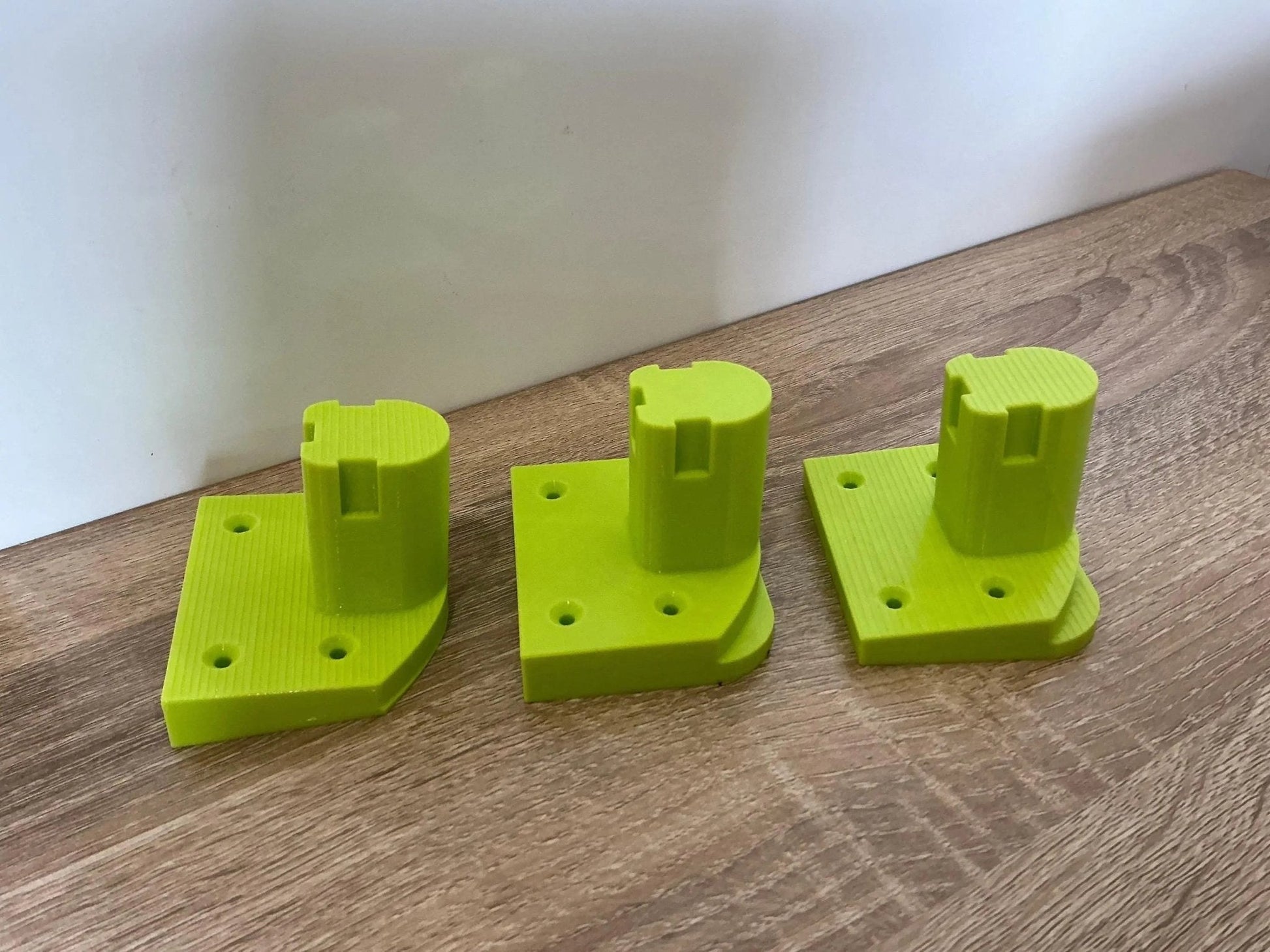 Ryobi Tool Mounts for Efficient Wall or Bench Storage – Organize Garage & Workshop. Display of colorful tool mounts, emphasizing their capability for effective organization in workshops or garages.