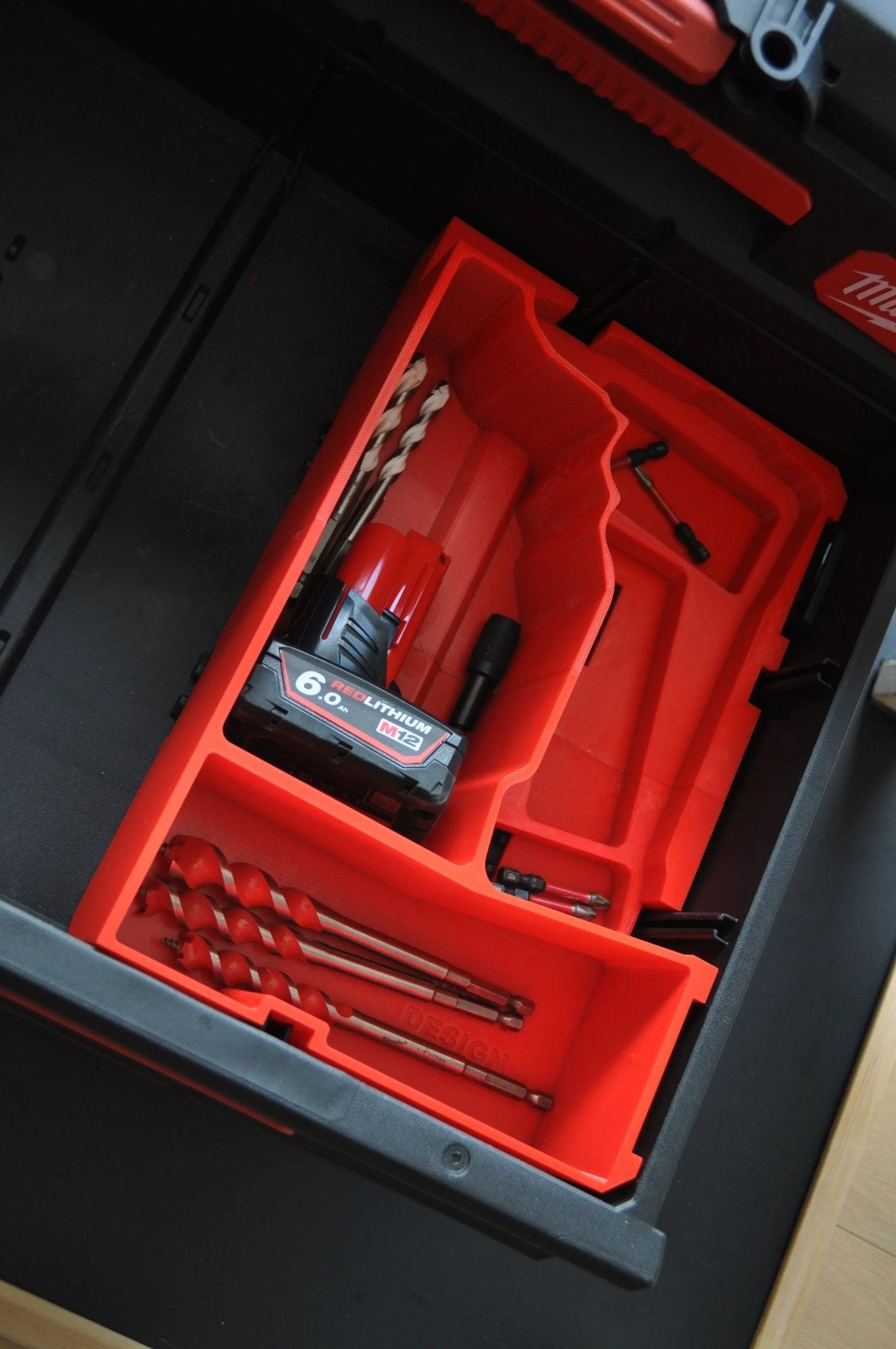 Milwaukee M12 Fuel Drill Gen 3 Packout Insert displaying a compact design with designated areas for drill accessories and a lithium battery, specifically for model 3403-20.