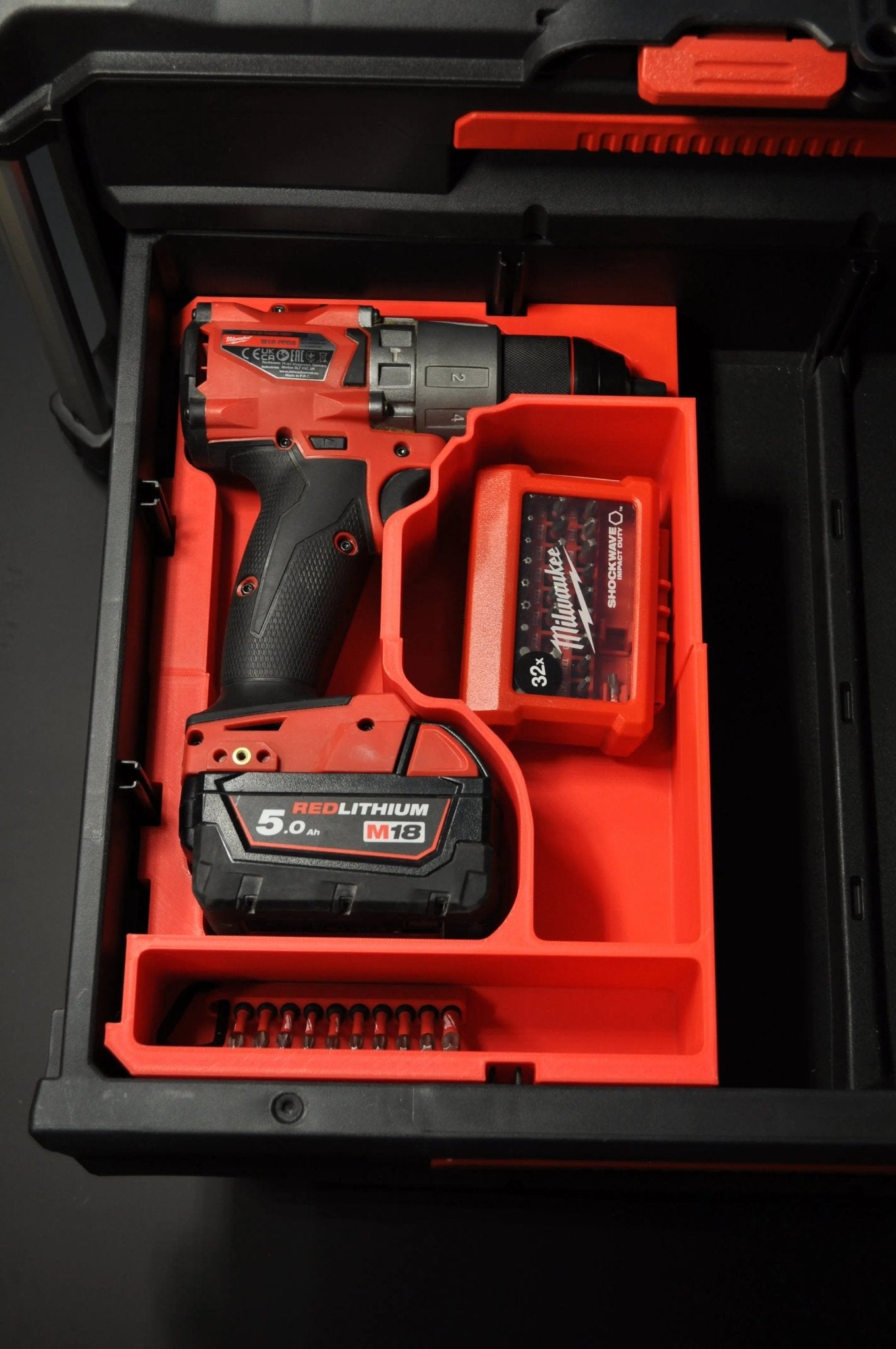 Milwaukee Packout Insert for M18 Fuel Hammer Drill Gen 4 featuring the drill and battery securely organized in the Packout box, enhancing tool accessibility and protection.